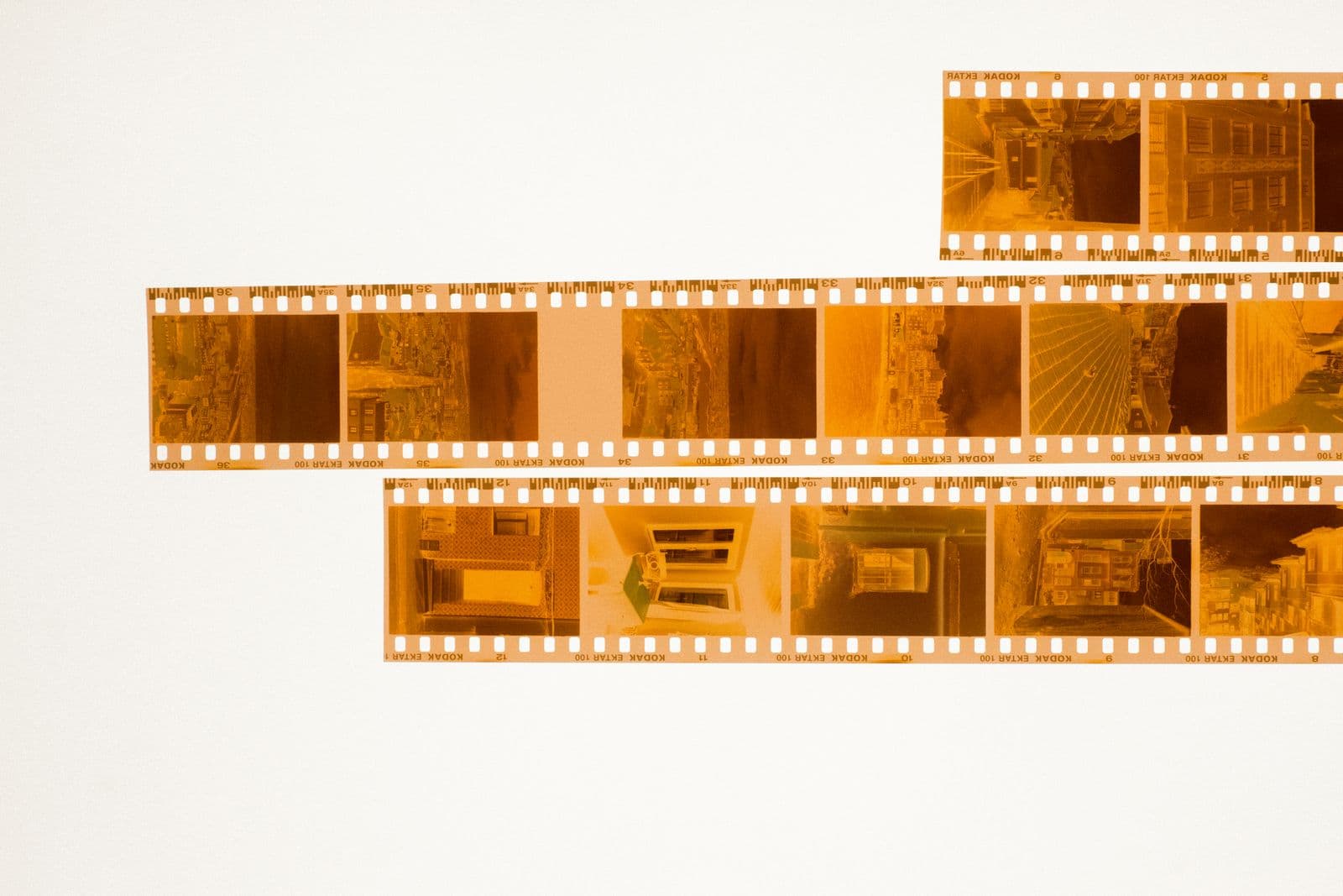 Colour 35mm film negatives laid out on a light table for scanning